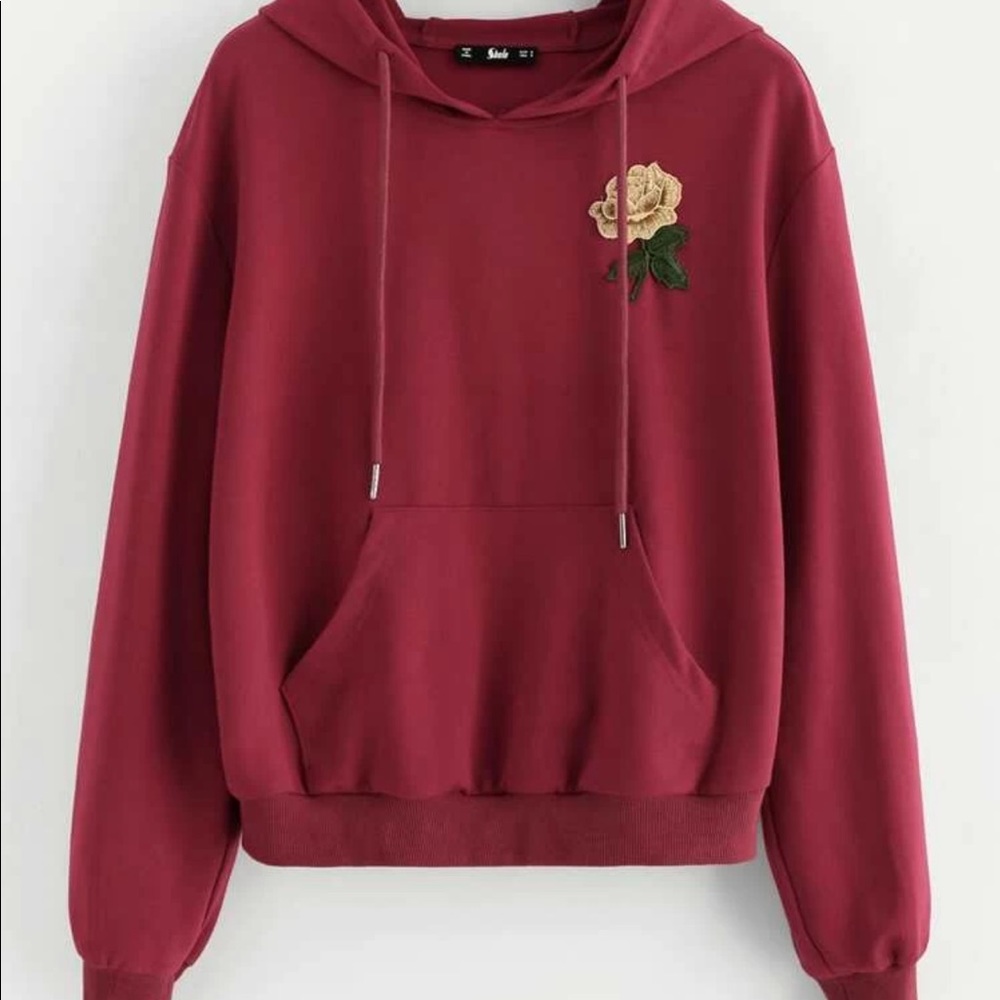 Red sweatshirt with yellow rose decal